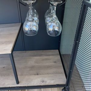 Complete bar with wine glasses whiskey n wine open